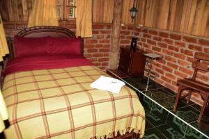 Postel nebo postele na pokoji v ubytování Hosteria Kindi Wasi