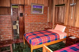Postel nebo postele na pokoji v ubytování Hosteria Kindi Wasi