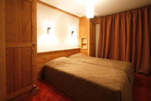 Voodi või voodid majutusasutuse Vacanceole - Résidence Goléon -Val Ecrins toas