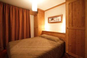 Postel nebo postele na pokoji v ubytování Vacanceole - Résidence Goléon -Val Ecrins
