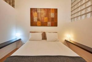 Ένα ή περισσότερα κρεβάτια σε δωμάτιο στο Timeless apartment at the heart of the village