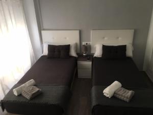 Postel nebo postele na pokoji v ubytování Guesthouse Central
