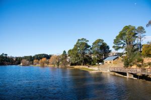 a view of a river with a bridge at Lake Daylesford Apartments 5 in Daylesford