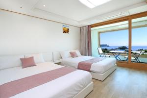 Postel nebo postele na pokoji v ubytování Marine Port Resort + 22 fotografií