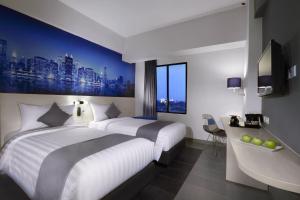Postel nebo postele na pokoji v ubytování Hotel Neo+ Kebayoran Jakarta