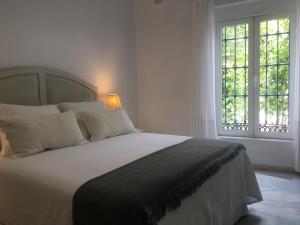 Posteľ alebo postele v izbe v ubytovaní Apartamento con Patio + 12 fotografií