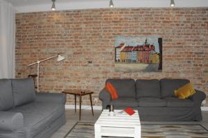 Posezení v ubytování MiłoTu - Apartament Marszałkowski + 35 fotografií
