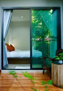 Кровать или кровати в номере Smile Home Krabi Klong Moung Beach