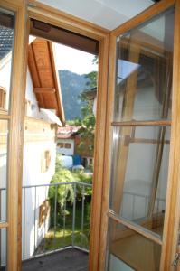 an open window with a view of a balcony at Kronburger in Oberammergau