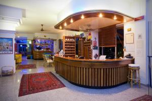 a large bar in a room with aperature at Hotel Playa e Mare Nostrum in Caorle