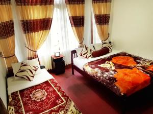 Giường trong phòng chung tại Nuwara Eliya Hills Rest