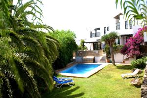 a backyard with a swimming pool and a house at Casa San Miguel in San Miguel de Abona