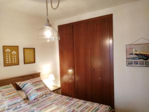 Postel nebo postele na pokoji v ubytování Apartamentos Nuncio Viejo