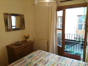Postel nebo postele na pokoji v ubytování Apartamentos Nuncio Viejo