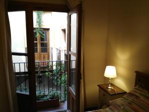 Postel nebo postele na pokoji v ubytování Apartamentos Nuncio Viejo
