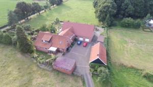 an aerial view of a house in a field at Am Waldrand in Schüttorf
