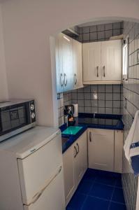 Kuchyň nebo kuchyňský kout v ubytování Bijou apartment in Bella Vista