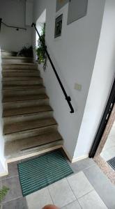 
a stairway leading up to a room with stairs at Guest House Šterk in Nova Gorica
