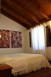 A bed or beds in a room at Villa Belfiore