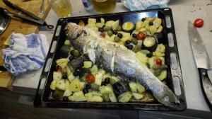a tray of food with fish and vegetables on a table at Guesthouse Porec in Poreč