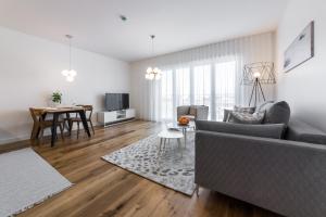 a living room with a couch and a table at Tallinn Premium Apartments in Tallinn