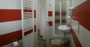 a bathroom with a toilet and a sink at La Bella Vita in San Vito dei Normanni