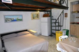 a bedroom with a bed and a staircase in it at villino annapaola in Vico Equense +46 photos