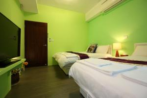 Postel nebo postele na pokoji v ubytování Xincheng Old Street B&B