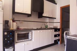 Η κουζίνα ή μικρή κουζίνα στο Appartement Pinogrande +6 φωτογραφίες