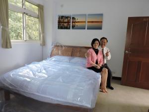 Postel nebo postele na pokoji v ubytování Shan Hu Lian Homestay