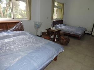 Postel nebo postele na pokoji v ubytování Shan Hu Lian Homestay