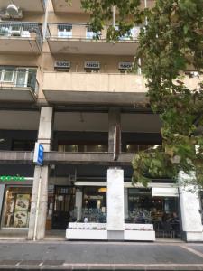 a store front of a building on a city street at Luxurious Street Apartments in Catania