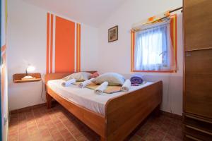 a bedroom with a bed in a room at The Sea House Apartments in Vis