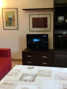 A television and/or entertainment centre at Residence IL PODERE