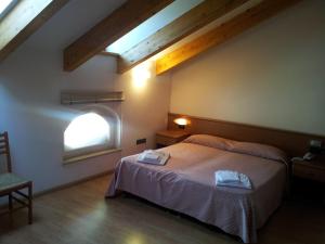 Cama o camas de una habitación en Hotel Vittoria
