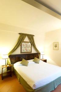 מיטה או מיטות בחדר ב-Relais Corte Paradiso
