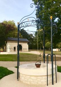 a swing in the middle of a park at Chateau de Bellevue B&B et Appartements avec Piscine chauffée et Chambres partout climatisées in Saint-Avit