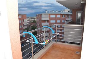 a towel rack on the balcony of a building at Novi Apartman in Strumica