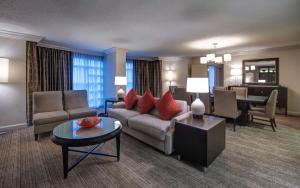 a living room with a couch and a table at Hyatt Regency Reston in Reston