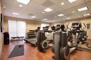 a gym with treadmills and elliptical machines at Hyatt Place Raleigh Durham Airport in Morrisville