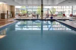 a large swimming pool in a large room at Hyatt Place Boulder/Pearl Street in Boulder