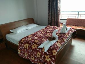 Ένα ή περισσότερα κρεβάτια σε δωμάτιο στο Viewtiful Homestay