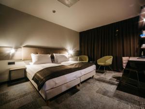 Posteľ alebo postele v izbe v ubytovaní Q Hotel Plus Katowice