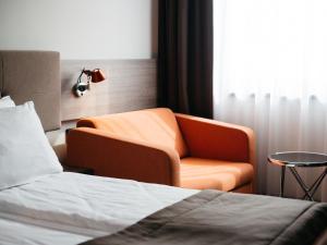 Posteľ alebo postele v izbe v ubytovaní Q Hotel Plus Katowice