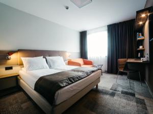 Postel nebo postele na pokoji v ubytování Q Hotel Plus Katowice