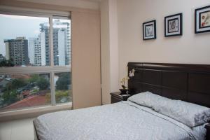 Postel nebo postele na pokoji v ubytování Downtown Apartments "Altos del Sur"