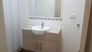 A bathroom at Sarina Hotel