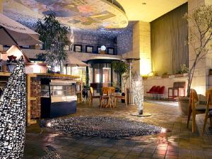 a lobby with a christmas tree in a restaurant at New Osaka Hotel Shinsaibashi in Osaka