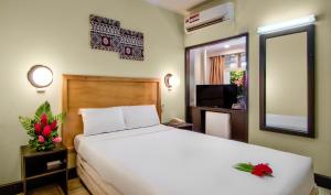 Postel nebo postele na pokoji v ubytování Tanoa Skylodge Hotel
