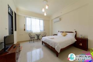 מיטה או מיטות בחדר ב-Sand Po Dang B&B II
